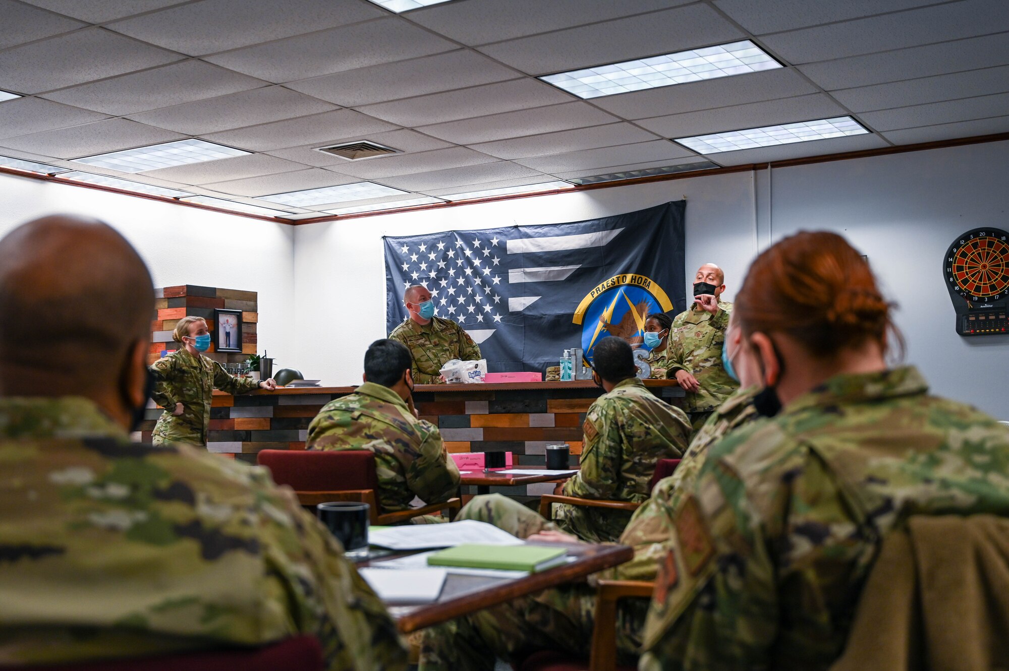 Airmen from the 97th Logistics Readiness Squadron attend an Operation GRIT meeting at Altus Air Force Base, Oklahoma, Jan. 19, 2022. Supervisors and leadership meet monthly to discuss the GRIT topic and prepare supervisors to talk to junior Airmen. (U.S. Air Force photo by Senior Airman Kayla Christenson)