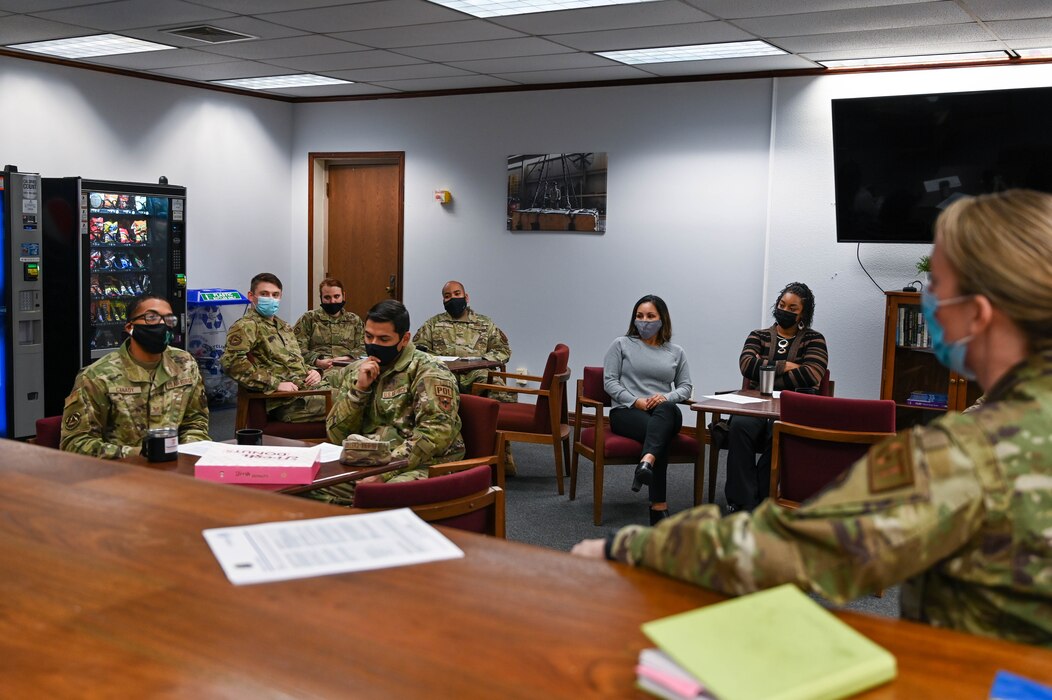 Staff Sgt. Aaron Canady, 97th Logistics Readiness Squadron non-commissioned officer in charge training and support, talks with 97th LRS Airmen at an Operation GRIT meeting at Altus Air Force Base, Oklahoma, Jan. 19, 2022. Meetings take place monthly, one between supervisors and leadership and another between supervisors and junior Airmen. (U.S. Air Force photo by Senior Airman Kayla Christenson)