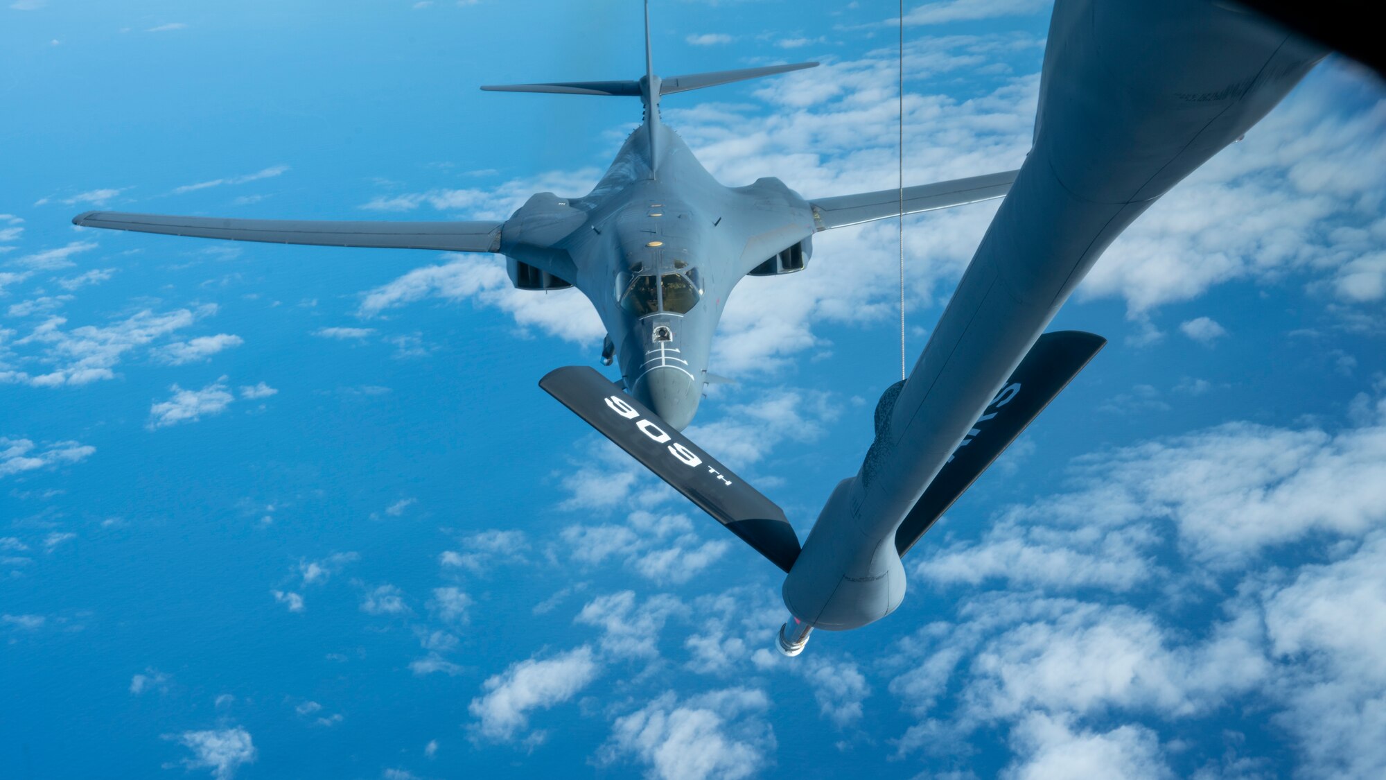 A B-1B Lancer from the 7th Bomber Wing prepares to receive fuel from a KC-135R Stratotanker over the Pacific Ocean