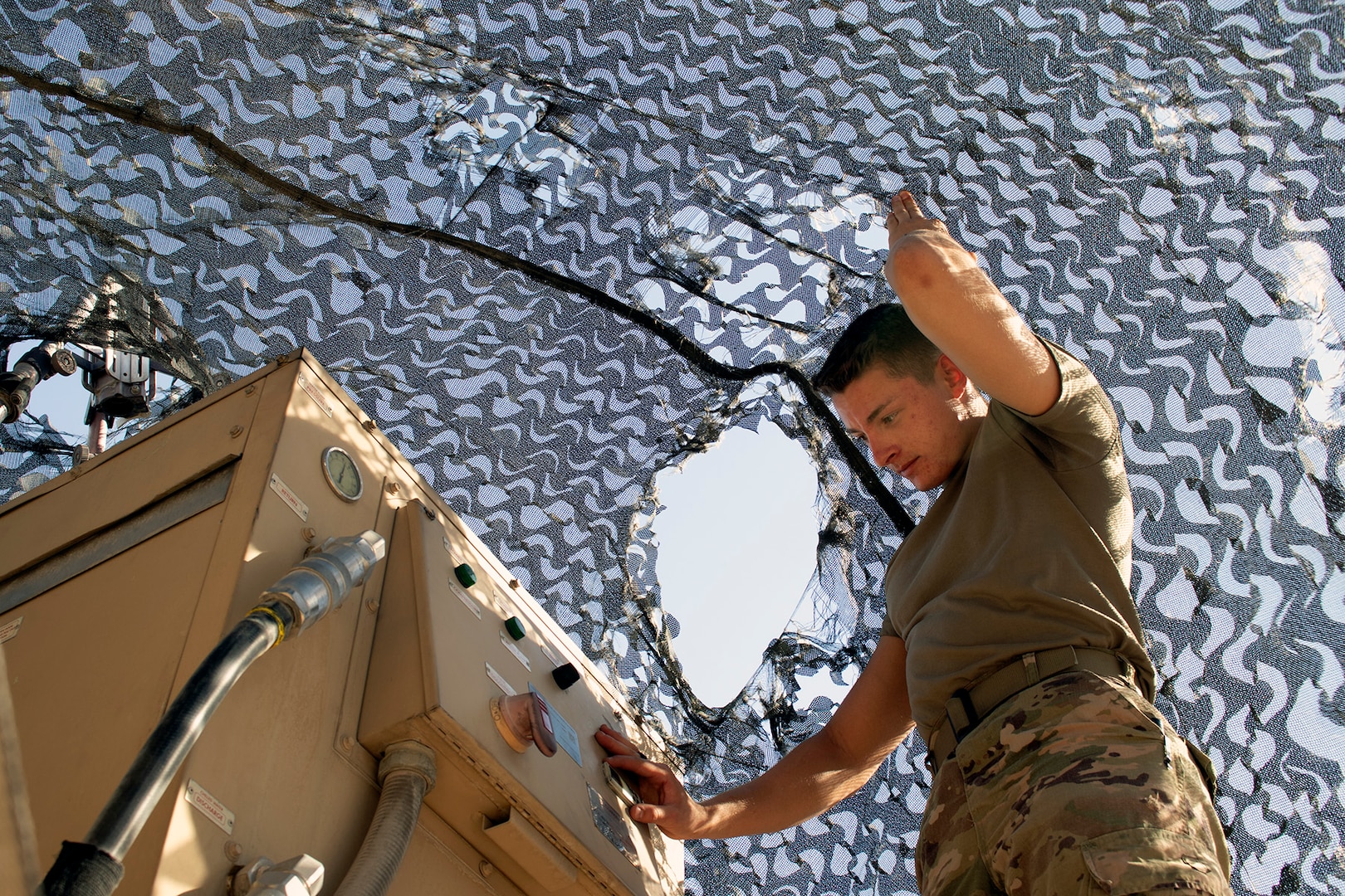 U.S. Army Spc. Corbin Doll, a forward observer with 1st Battalion, 194th Field Artillery, mans a Counter-Rocket, Artillery, Mortar gun at Al Asad Air Base, Iraq, on June 7, 2021. As a forward observer, Doll has been trained to help direct artillery and mortar fire. (U.S. Army National Guard photo by Sgt. 1st Class Christie R. Smith)