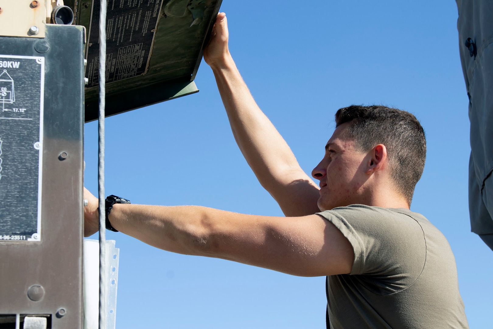 U.S. Army Spc. Corbin Doll, a forward observer with 1st Battalion, 194th Field Artillery, inspects a Counter-Rocket, Artillery, Mortar gun at Al Asad Air Base, Iraq, on June 7, 2021. Doll was manning the C-RAM when it fired on an enemy unmanned aerial vehicle that was threatening the base in the early morning hours of June 5, 2021. (U.S. Army National Guard photo by Sgt. 1st Class Christie R. Smith)