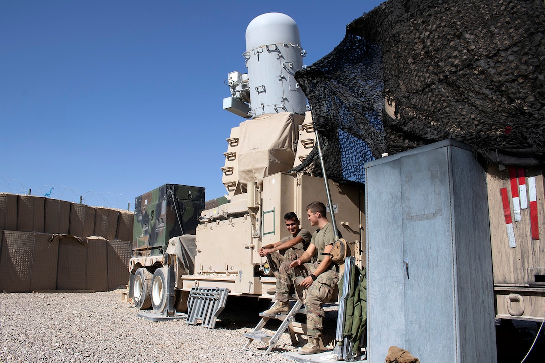 U.S. Army Spc. Abraham Salgado, a canon crewmember, and Spc. Kristian Kelly, a small arms artillery repair specialist, both with the 1st Battalion, 194th Field Artillery, man a Counter-Rocket, Artillery, Mortar gun at Al Asad Air Base, Iraq, on June 7, 2021. This gun was the first C-RAM in history to engage and destroy an enemy unmanned aerial vehicle during an attack at Al Asad Air Base on June 5, 2021. (U.S. Army National Guard photo by Sgt. 1st Class Christie R. Smith)