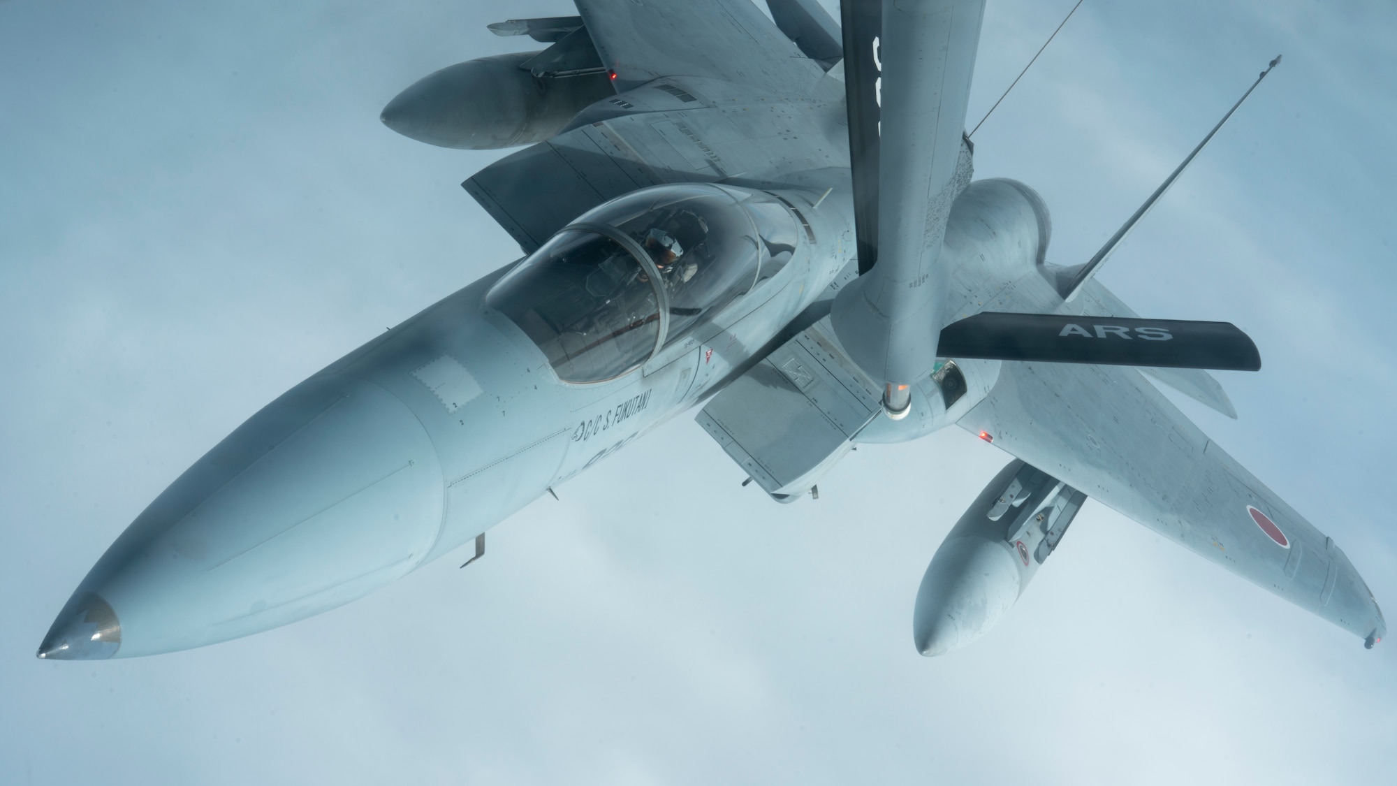 A Japan Air Self-Defense Force F-15J receives fuel from a 909th Air Refueling Squadron KC-135 Stratotanker in support of Exercise Southern Beach over the Pacific Ocean