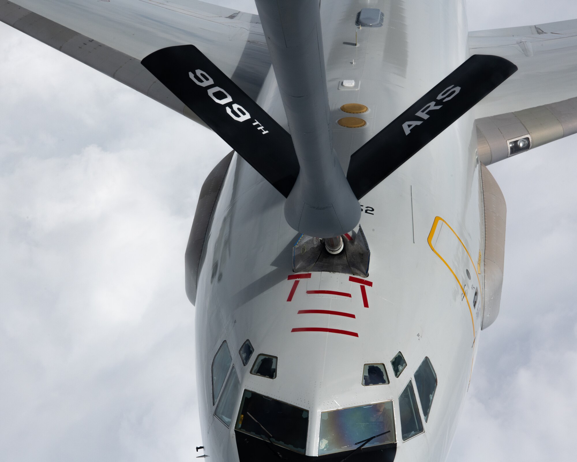 A U.S. Air Force E-3G Sentry receives fuel from a KC-135 Stratotanker
