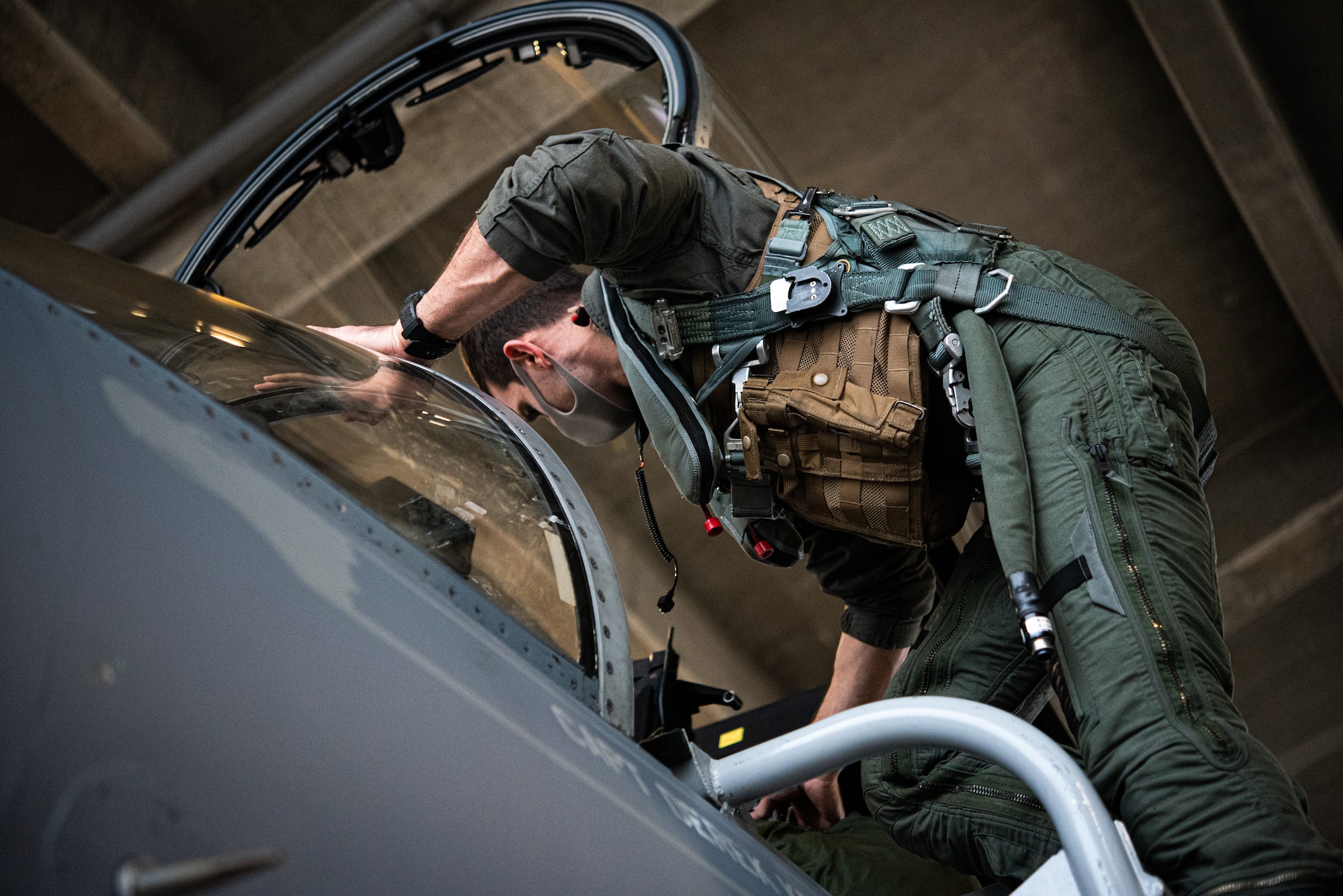 pilot climbs into F-15
