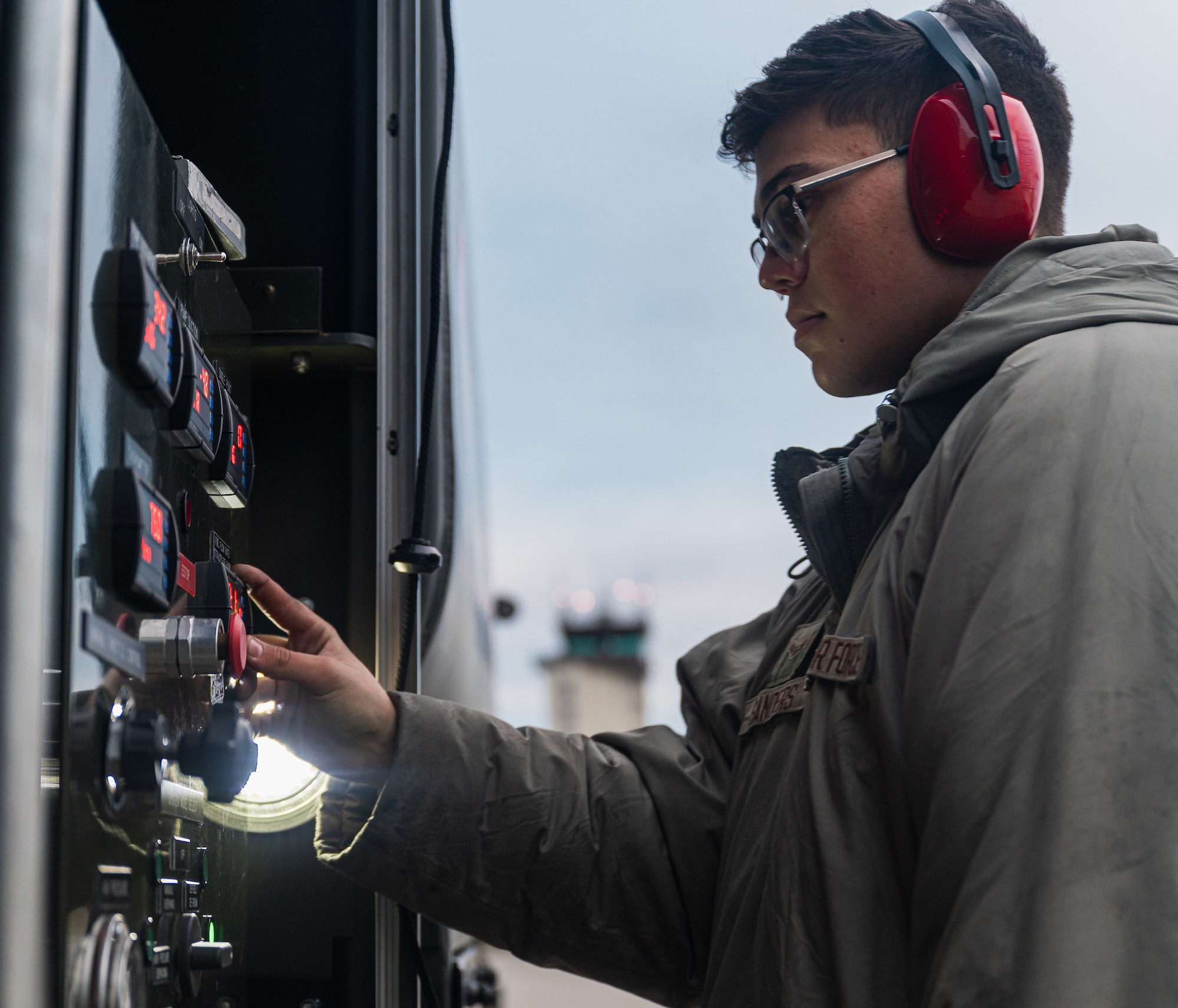 Airman presses buttons
