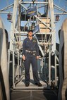 220112-A-AI379-1018 NAVAL SUPPORT ACTIVITY BAHRAIN (Jan. 12, 2022) Lt. Cmdr. Brittany Lynn, commanding officer of patrol coastal ship USS Sirocco (PC 6), poses for a photo aboard the ship. Sirocco’s crew, commanded by Lynn, safely rescued five mariners in the Gulf of Oman when their fishing vessel exploded, Dec. 15, 2021. (U.S. Army photo by Cpl. DeAndre Dawkins)
