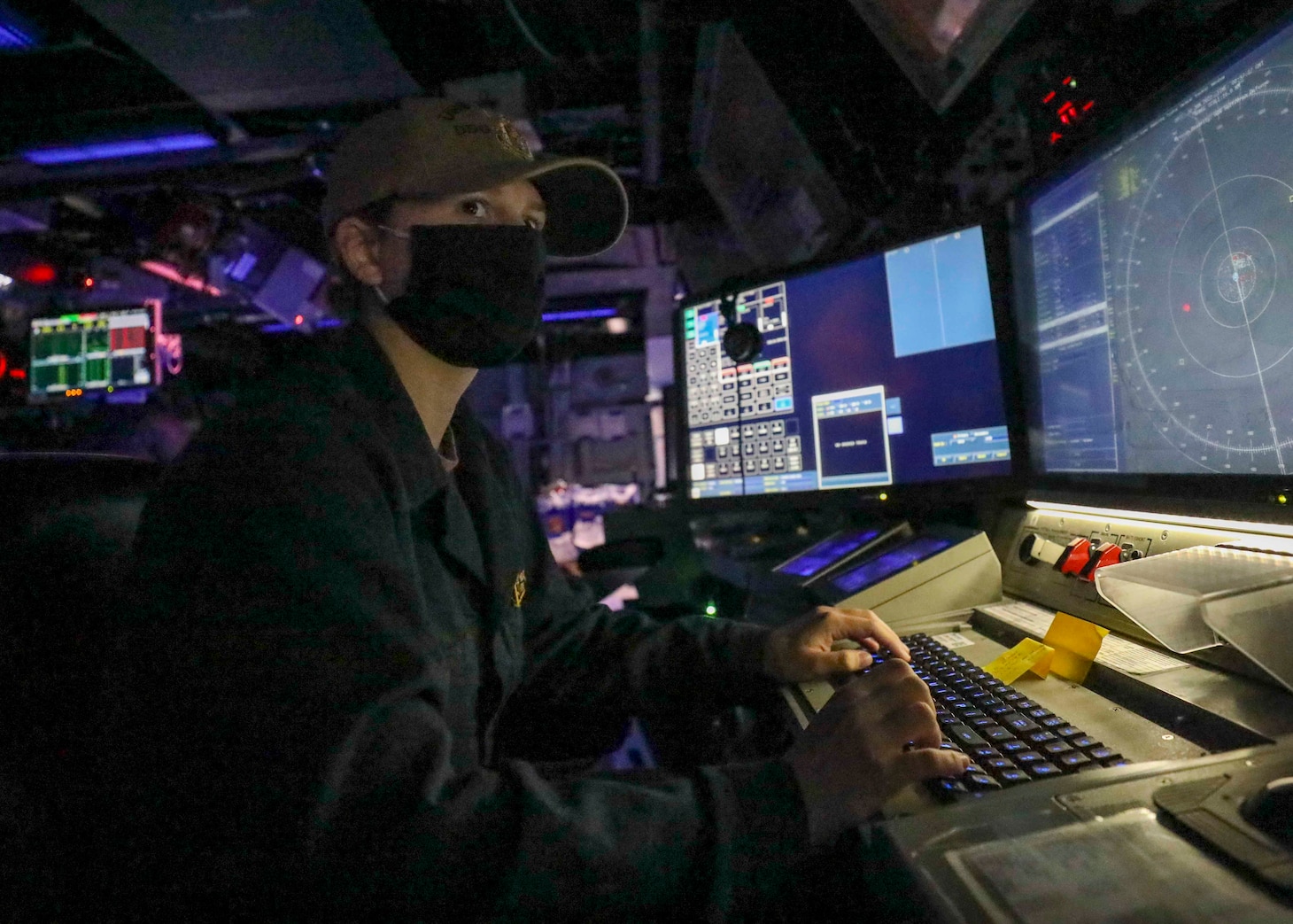 Ensign Kellen E. Peddicord, from Santa Barbara, Calif., monitors surface contacts from the combat information center as Arleigh Burke-class guided-missile destroyer USS Benfold (DDG 65) conducts routine underway operations. Benfold is forward-deployed to the U.S. 7th Fleet area of operations in support of a free and open Indo-Pacific.