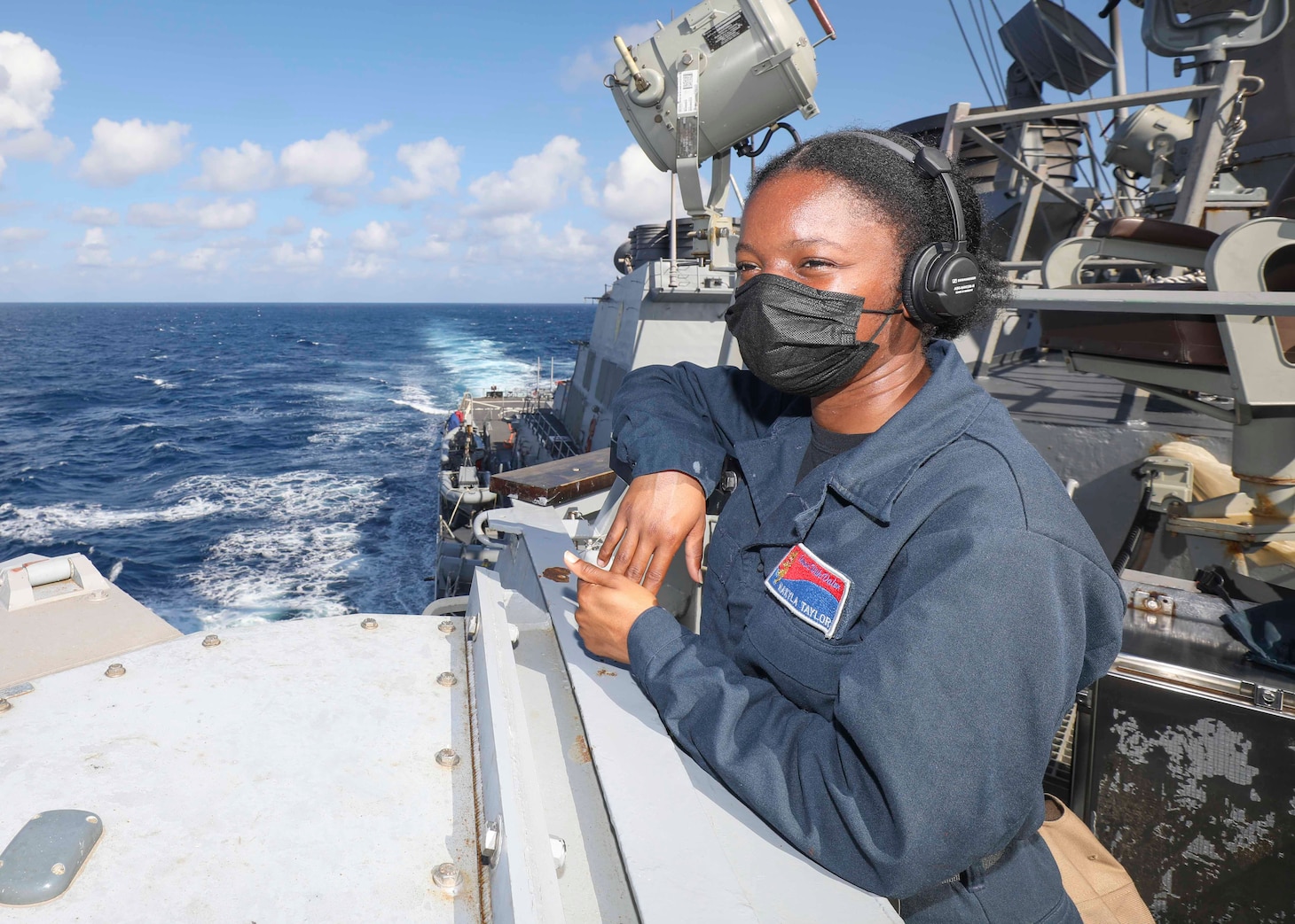 Seaman Nakyla Taylor, from San Diego, stands lookout watch on the bridgewing as Arleigh Burke-class guided-missile destroyer USS Benfold (DDG 65) conducts routine underway operations. Benfold is forward-deployed to the U.S. 7th Fleet area of operations in support of a free and open Indo-Pacific.