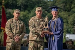 Mountaineer Challenge Academy Cadet William Farkas with Brig. Gen. William "Bill" Crane, adjutant general of the West Virginia National Guard, and Command Sgt. Maj. Dusty Jones, Senior Enlisted Leader, while receiving the Adjutant General's Award for Academic Excellence. Farkas has received an appointment to West Point.