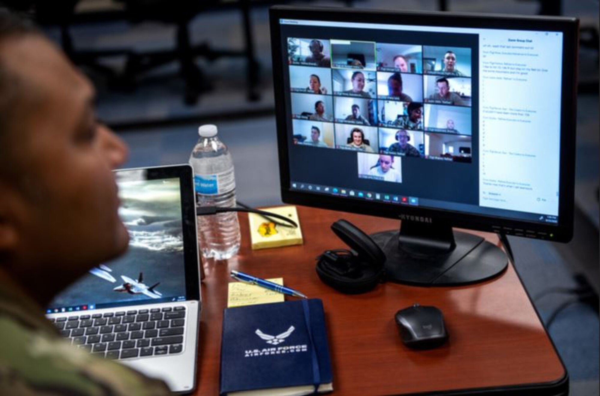 Image of Airmen looking at screen