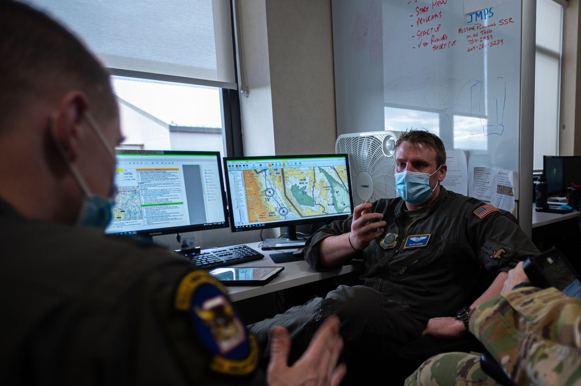 Instructor discusses course with student