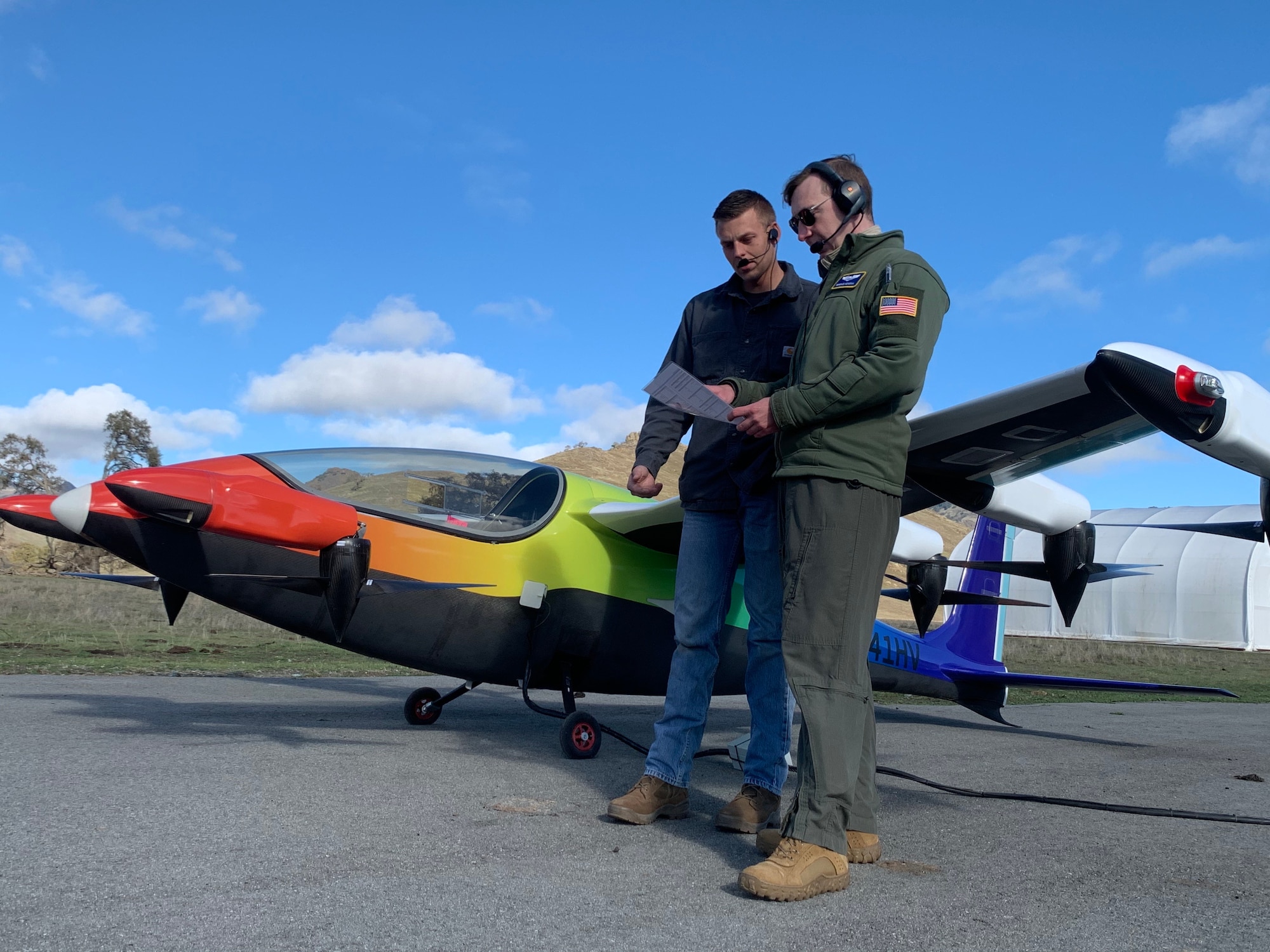 Parker Downey, left, of Kittyhawk, and Terrence McKenna, an Air Force Reserve pilot with the 370th Flight Test Squadron and the Test and Experimentation Lead for AFWERX Agility Prime, (right) conduct preflight checks in anticipation of the first Heaviside flight by an Air Force pilot. (Courtesy photo)