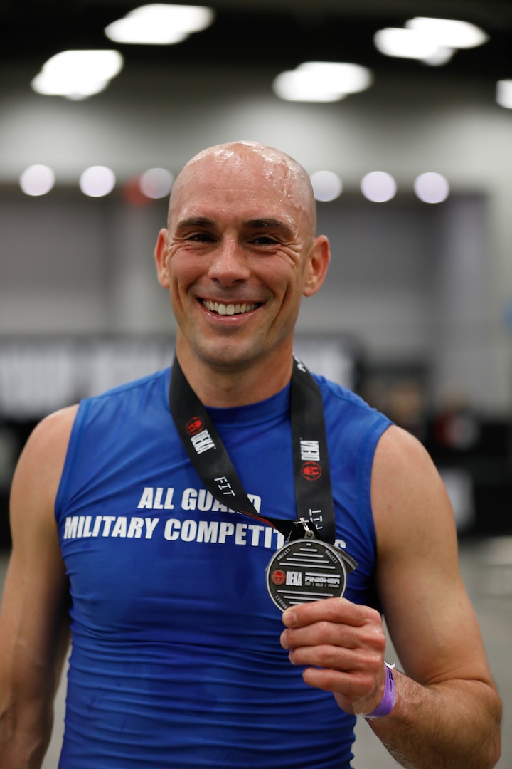 U.S. Army Maj. Robert Killian, a signal officer with the Joint Forces Headquarters, California National Guard, poses with his medal after completing the Spartan DEKA FIT fitness competition in Austin, Texas, Jan. 15, 2022. Killian finished first in the men's category.