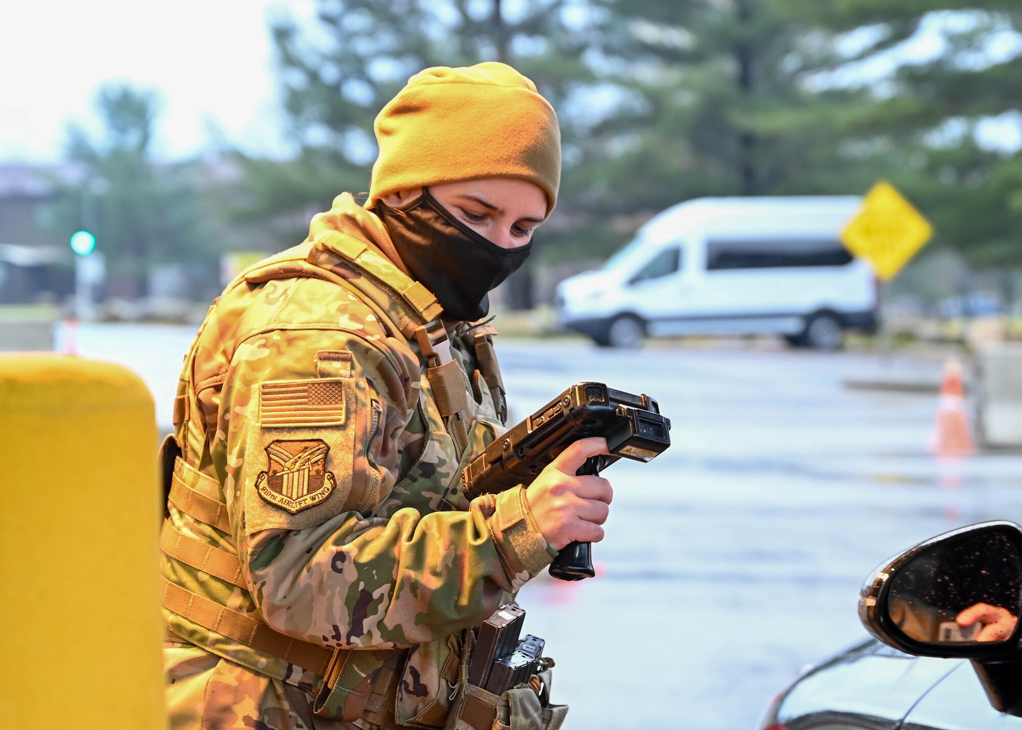 Senior Airman Viktoria Senkiv, a fireteam member assigned to the 910th Security Forces Squadron, checks an ID card at Youngstown Air Reserve Station’s front gate, Dec. 6, 2021.