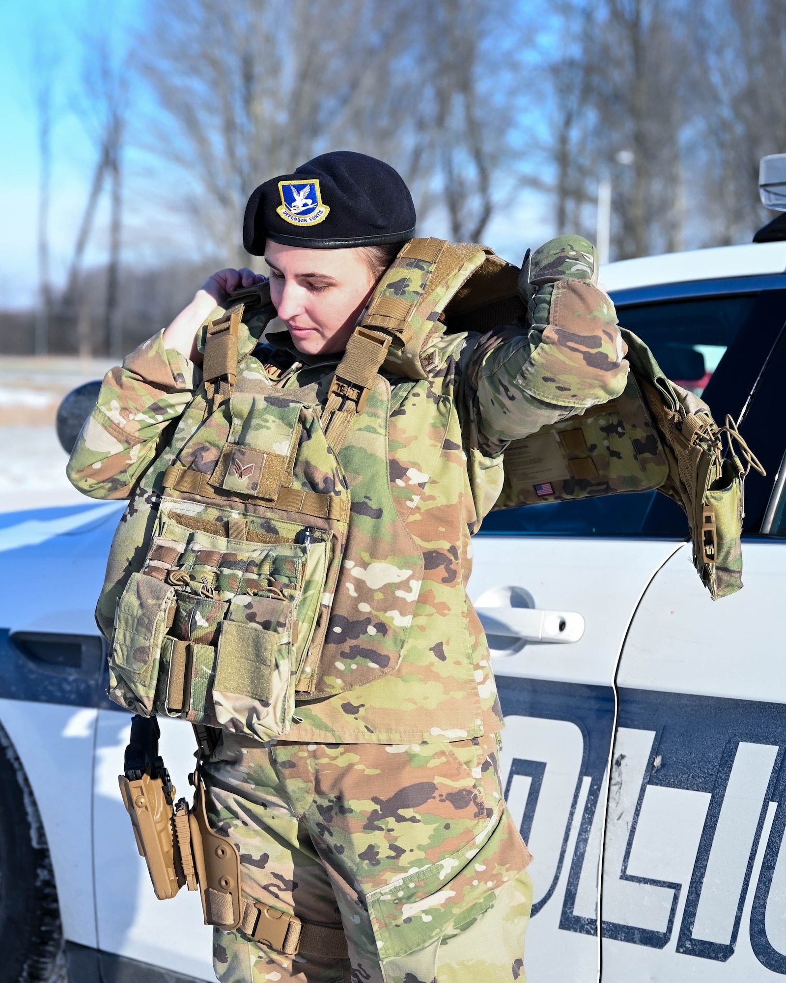Senior Airman Viktoria Senkiv, a fireteam member assigned to the 910th Security Forces Squadron, dons her flak vest outside Youngstown Air Reserve Station’s Combat Arms Training and Maintenance firing range 8 January, 2022.
