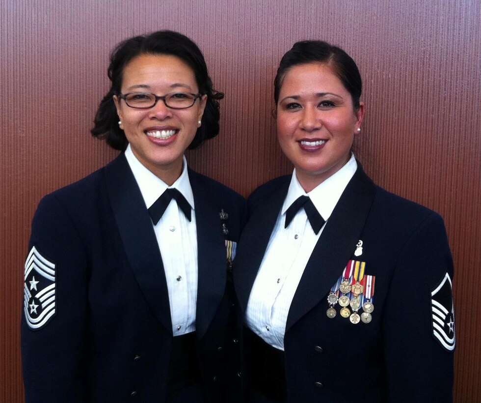 Chief Master Sgt. Kim Groat, the current state command chief for the Alaska Air National Guard, and retired Chief Master Sgt. Tran Brunsberg (left), her sister and the former command chief of the Alaska Air National Guard's 168th Wing, pose for a photo together. (Courtesy photo)