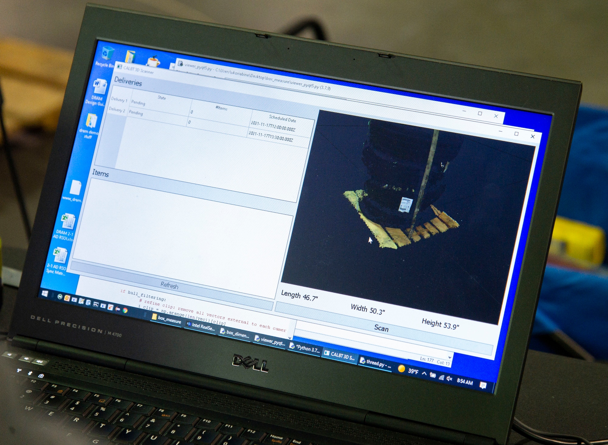 A laptop displays a scanned pallet with five tires during Configured Air Load Building Tool testing on Dover Air Force Base, Delaware, Nov. 17, 2021. The Light Detection and Ranging cameras captured and produced 3D images of cargo being delivered to the 436th Aerial Port Squadron. CALBT is an Aerial Port of the Future initiative currently under development. (U.S. Air Force photo by Roland Balik)