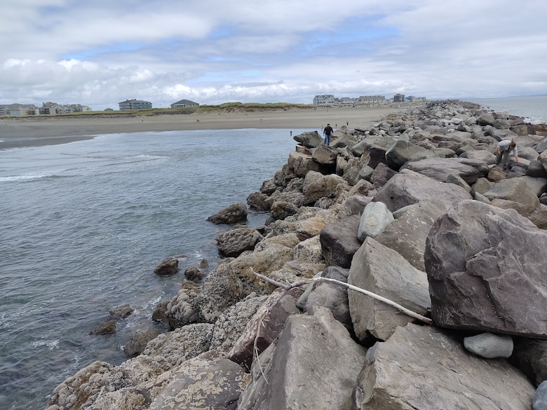 View from standing on the seaward side of the north jetty with the beach and Ocean Shores, Washington in the background.
