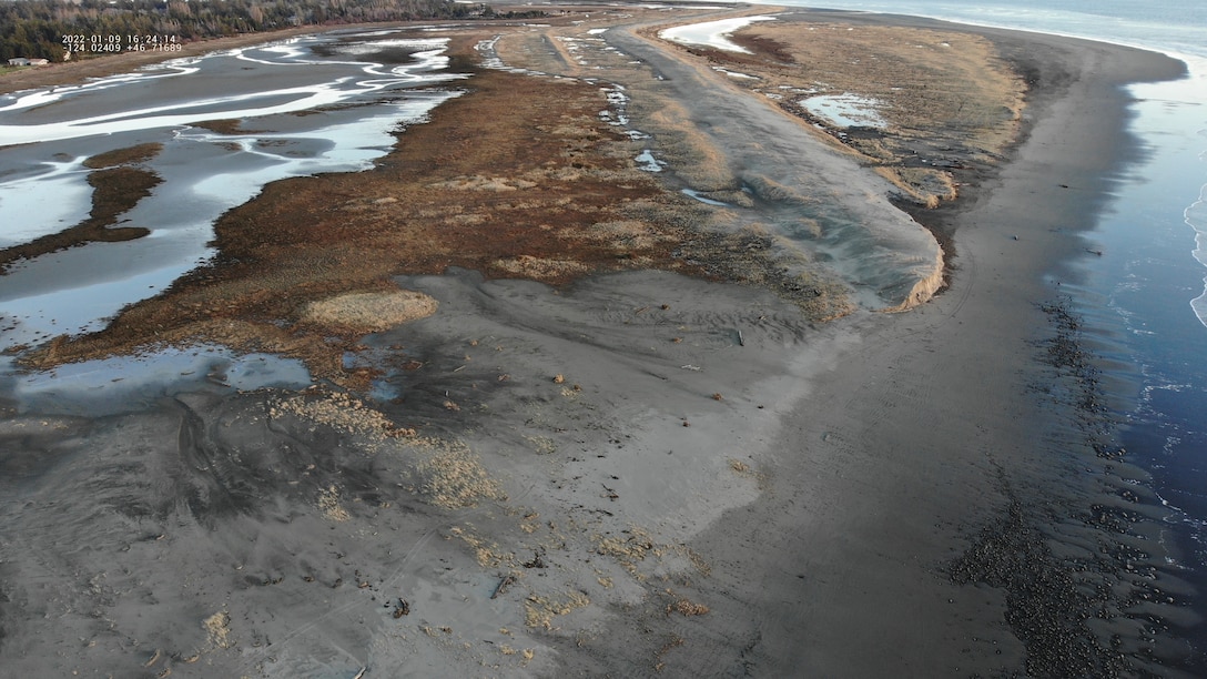 Overhead image shows the existing berm in the background and in the foreground is the area that has been washed away by storms and wave activity.