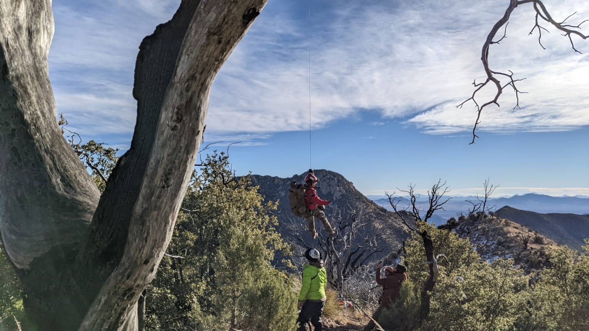 Airmen hoists patient to HH-60