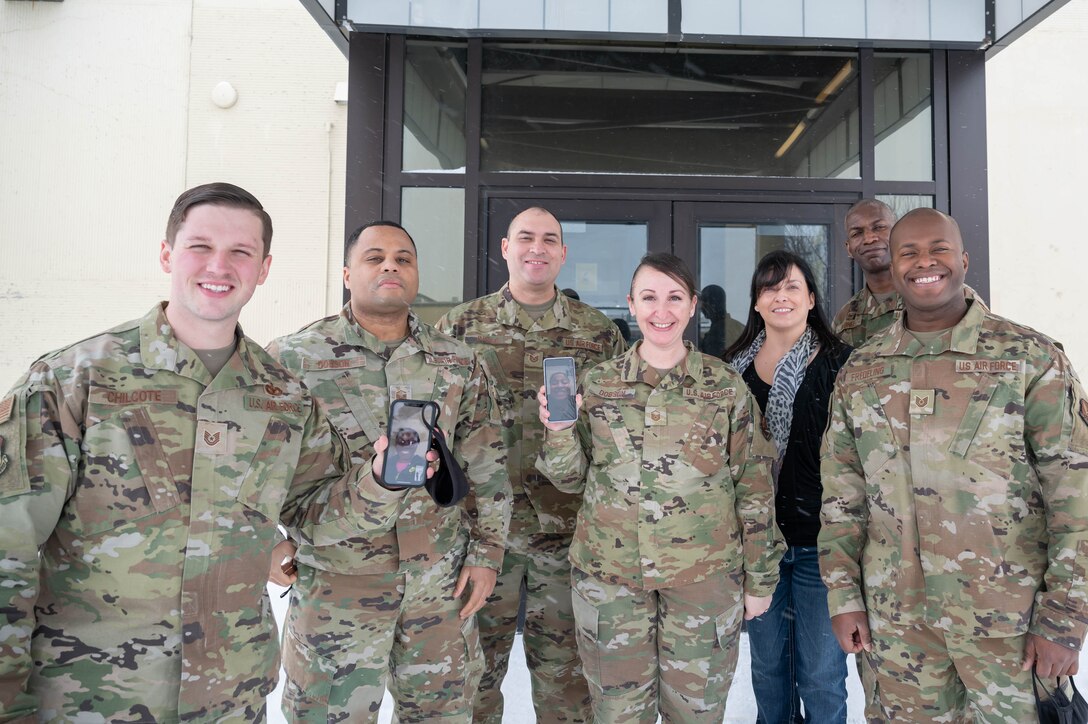 Members of the Diversity and Inclusion council pose for a photo after a teleconference with Air Force Global Strike Command leadership congratulating them on being named the Air Force 2021 D&I Team of the Year Jan. 18, 2022, at Malmstrom Air Force Base, Mont.