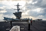 Sailors assigned to the Nimitz-class aircraft carrier USS Carl Vinson (CVN 70) and Carrier Air Wing (CVW) 2 conduct flight operations on the ship's flight deck, Jan. 17, 2022.