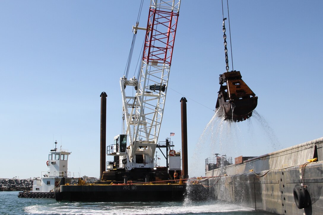 A maintenance dredges operates May 24, 2021, in Newport Bay Harbor.