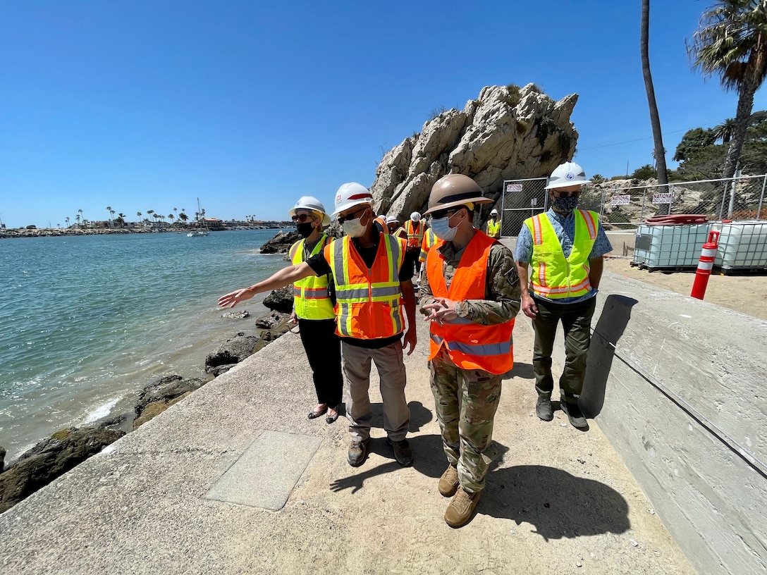 Col. Julie Balten, commander of the U.S. Army Corps of Engineers Los Angeles District, talks with onsite Corps of Engineers’ personnel and contractors to learn more about the progress of the Newport Bay Harbor maintenance dredging and east jetty repairs during a May 24, 2021, visit. While there, she met with Newport Beach Mayor Brad Avery and District 1 Councilwoman Diane Dixon.