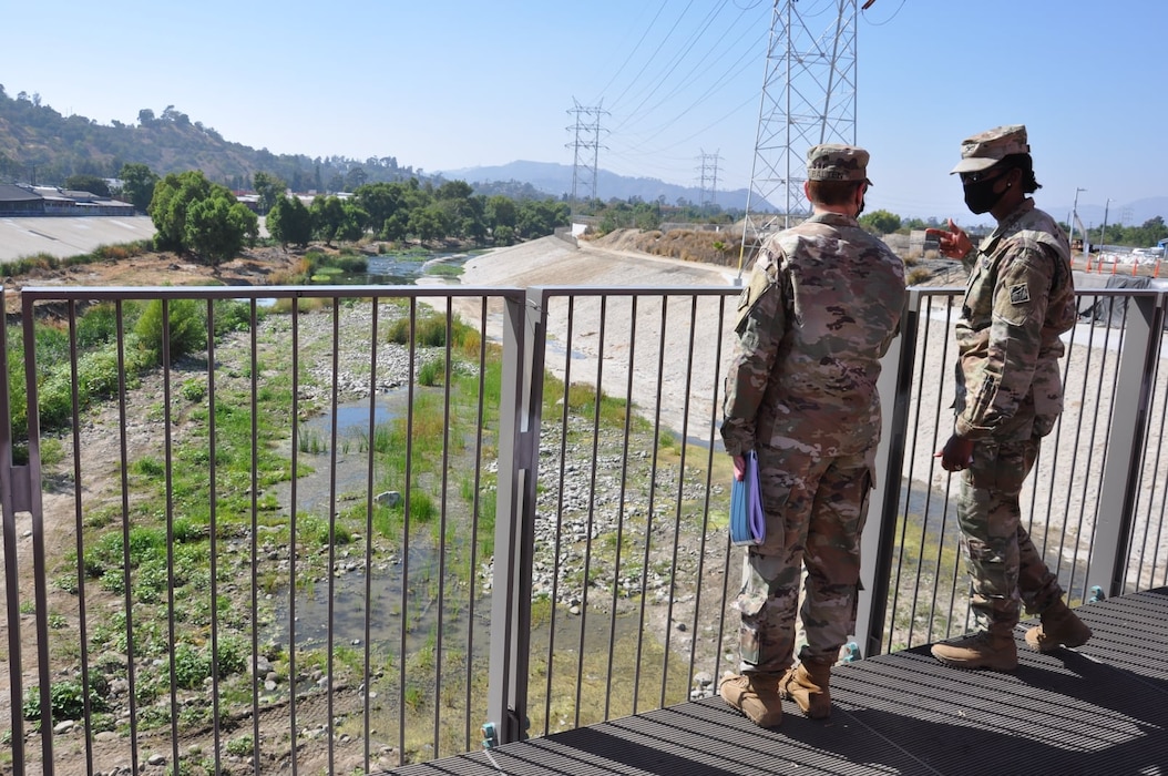 Col. Antoinette Gant, commander of the U.S. Army Corps of Engineers South Pacific Division, and Col. Julie Balten, commander of the Corps’ Los Angeles District, examine Reach 5 from a viewing platform over the Los Angeles River, Aug. 26, 2021. The Corps maintains about 11 miles of the Los Angeles River for the safety of millions of citizens down river.