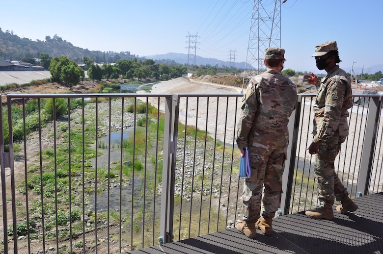 Col. Antoinette Gant, commander of the U.S. Army Corps of Engineers South Pacific Division, and Col. Julie Balten, commander of the Corps’ Los Angeles District, examine Reach 5 from a viewing platform over the Los Angeles River, Aug. 26, 2021. The Corps maintains about 11 miles of the Los Angeles River for the safety of millions of citizens down river.
