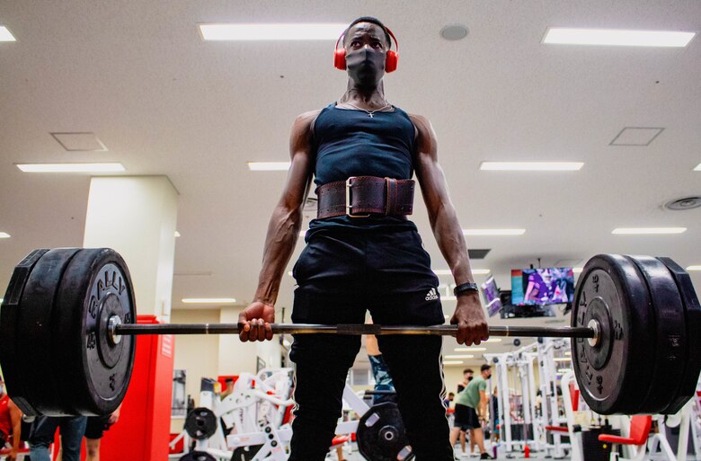 U.S. Marine Corps Pfc. Benjamin Crayton, a motor vehicle operator with Headquarters and Support Battalion, Marine Corps Installations Pacific, conducts a barbell deadlift on Camp Foster, Okinawa, Japan, Jan. 10, 2022. Crayton was born in Monrovia, Liberia during the First Liberian Civil War, and immigrated to Europe as a refugee. When he was 17 years old he moved to the U.S. and in 2021 he enlisted in the Marine Corps. (U.S. Marine Corps photo by Lance Cpl. Jonathan Beauchamp)