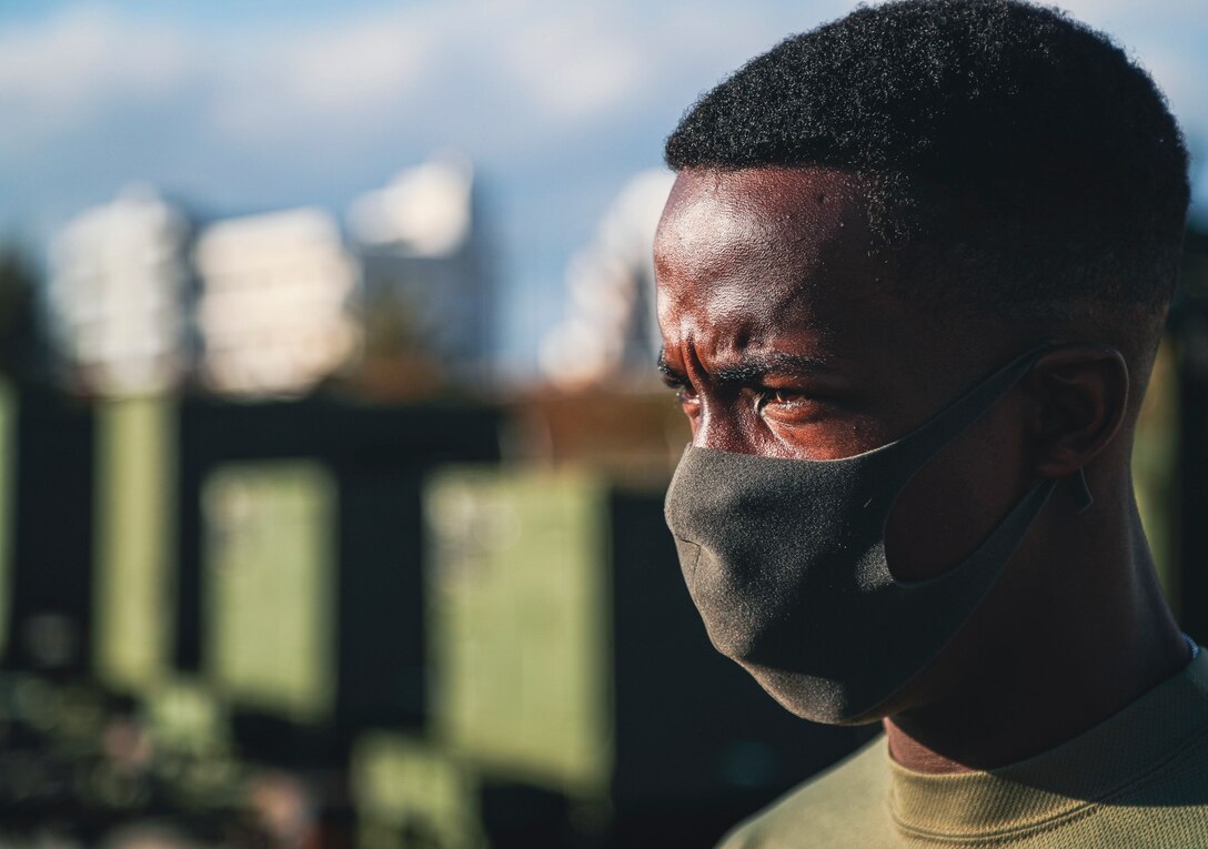 U.S. Marine Corps Pfc. Benjamin Crayton, a motor vehicle operator with Headquarters and Support Battalion, Marine Corps Installations Pacific, observes the motor pool during an inspection of a Humvee on Camp Foster, Okinawa, Japan, Jan. 10, 2022. Crayton was born in Monrovia, Liberia during the First Liberian Civil War, and immigrated to Europe as a refugee. When he was 17 years old he moved to the U.S. and in 2021 he enlisted in the Marine Corps. (U.S. Marine Corps photo by Lance Cpl. Jonathan Beauchamp)