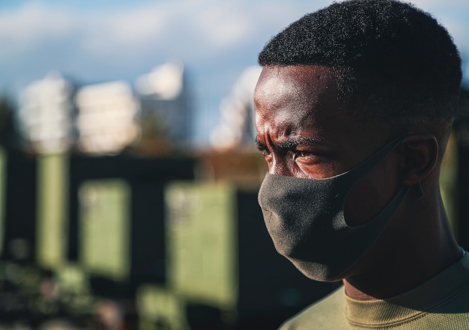 U.S. Marine Corps Pfc. Benjamin Crayton, a motor vehicle operator with Headquarters and Support Battalion, Marine Corps Installations Pacific, observes the motor pool during an inspection of a Humvee on Camp Foster, Okinawa, Japan, Jan. 10, 2022. Crayton was born in Monrovia, Liberia during the First Liberian Civil War, and immigrated to Europe as a refugee. When he was 17 years old he moved to the U.S. and in 2021 he enlisted in the Marine Corps. (U.S. Marine Corps photo by Lance Cpl. Jonathan Beauchamp)