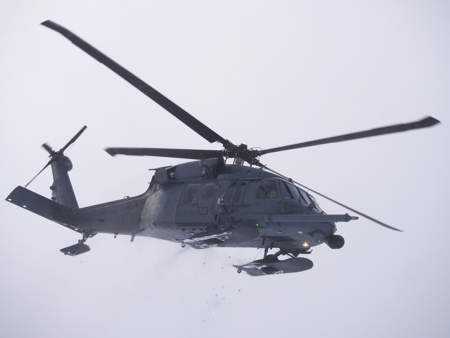 An Alaska Air National Guard 210th Rescue Squadron HH-60G Pave Hawk transits Joint Base Elmendorf-Richardson's Malamute Drop Zone Feb. 10, 2021, during parachute jump operations.