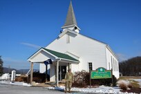 Chaplain (Lt. Col.) Schaun Myers, Pennsylvania National Guard Joint Force Headquarters chaplain, poses outside the main post chapel at Fort Indiantown Gap, Pa., on Jan. 19, 2022.