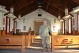 Chaplain (Lt. Col.) Schaun Myers, Pennsylvania National Guard Joint Force Headquarters chaplain, poses inside the main post chapel at Fort Indiantown Gap, Pa., on Jan. 19, 2022.
