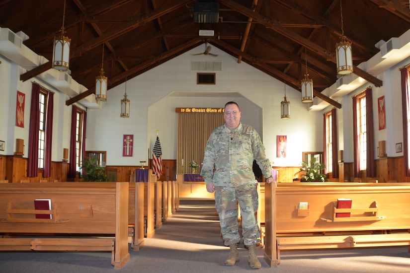 Chaplain (Lt. Col.) Schaun Myers, Pennsylvania National Guard Joint Force Headquarters chaplain, poses inside the main post chapel at Fort Indiantown Gap, Pa., on Jan. 19, 2022.