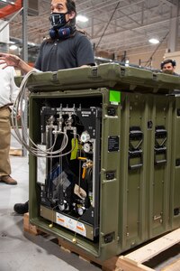 A biomedical equipment technician at the U.S. Army Medical Materiel Agency's Medical Maintenance Operations Division at Hill Air Force Base, Utah, works on a portable oxygen generator. (U.S. Army photo by Katie Ellis-Warfield/Released)