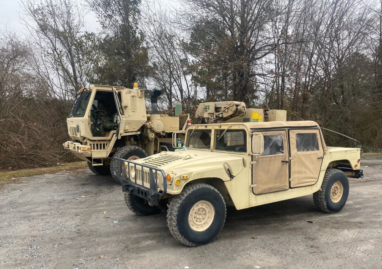 U.S. Army National Guard Soldiers with Company A, 151st Expeditionary Signal Battalion, South Carolina National Guard, stage personnel and equipment near Newberry, South Carolina, Jan. 21, 2022. The Soldiers were called in to help keep roads clear so first responders can assist people during anticipated severe winter weather.