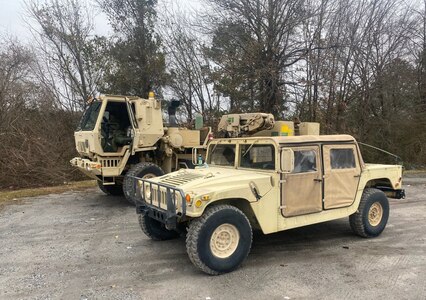 U.S. Army National Guard Soldiers with Company A, 151st Expeditionary Signal Battalion, South Carolina National Guard, stage personnel and equipment near Newberry, South Carolina, Jan. 21, 2022. The Soldiers were called in to help keep roads clear so first responders can assist people during anticipated severe winter weather.