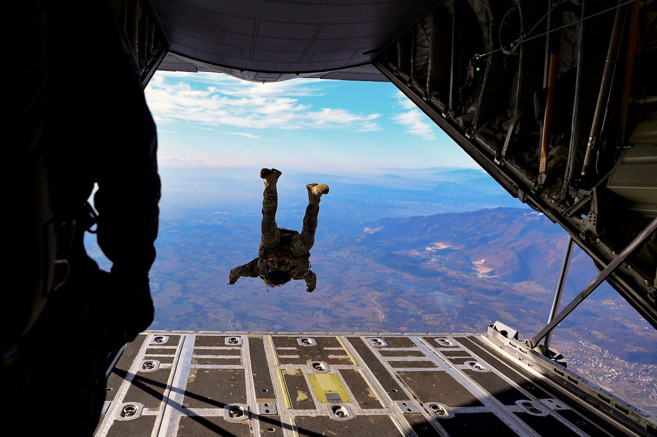 An airman free falls after jumping out of an airborne aircraft.