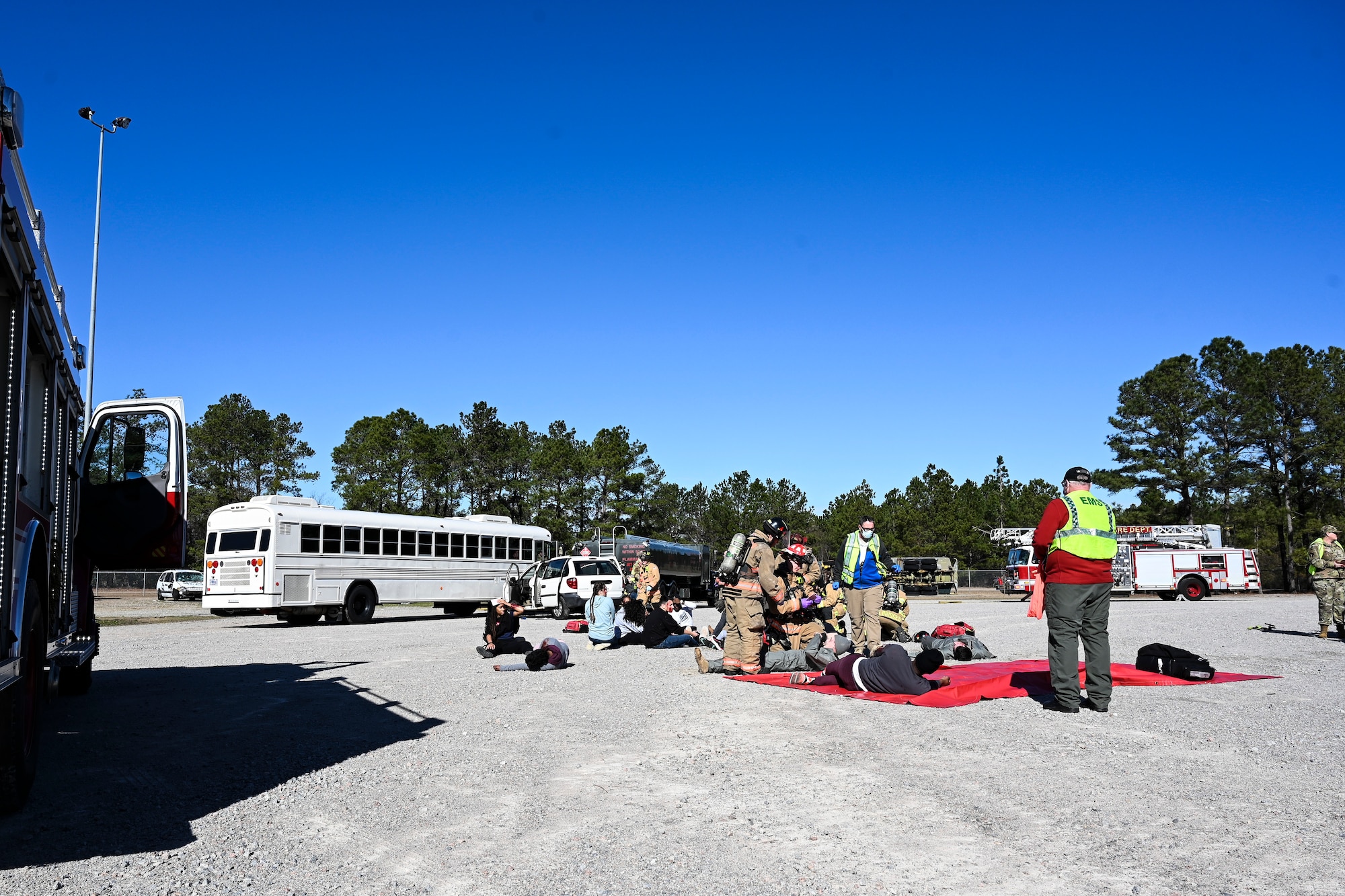 Emergency response personnel perform triage on injured volunteers during a mass casualty training exercise at Shaw Air Force Base, South Carolina, Jan. 19, 2022. The two-day exercise was designed to test and enhance the capabilities of multiple emergency response personnel. (U.S. Air Force photo by Senior Airman Madeline Herzog)