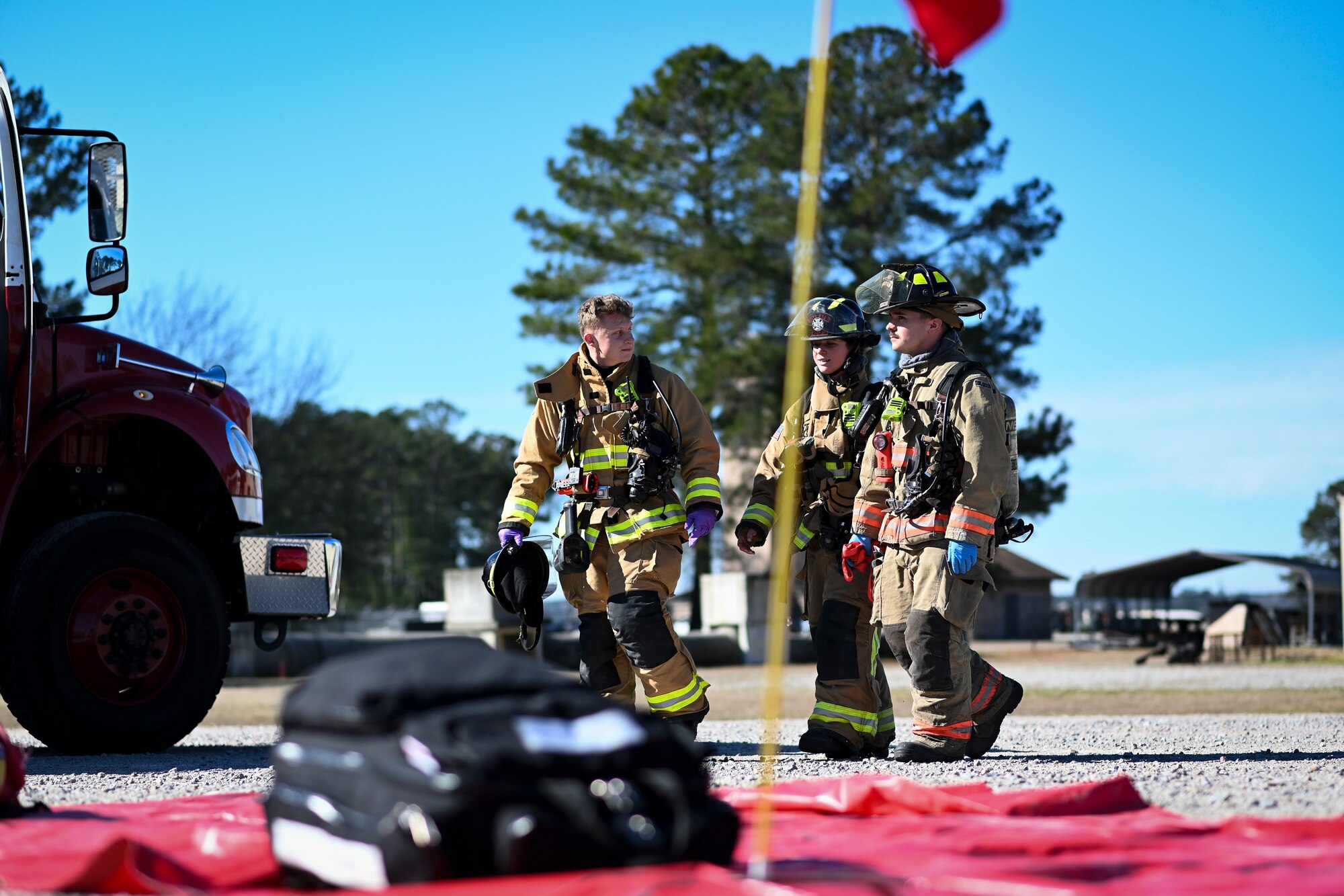 20th Civil Engineer Squadron firefighters walk back to the triage area during a mass casualty exercise at Shaw Air Force Base, South Carolina, Jan. 19, 2022. The purpose of the exercise was to enhance and build on each agency's readiness capabilities for quick response emergencies. (U.S. Air Force photo by Senior Airman Madeline Herzog)