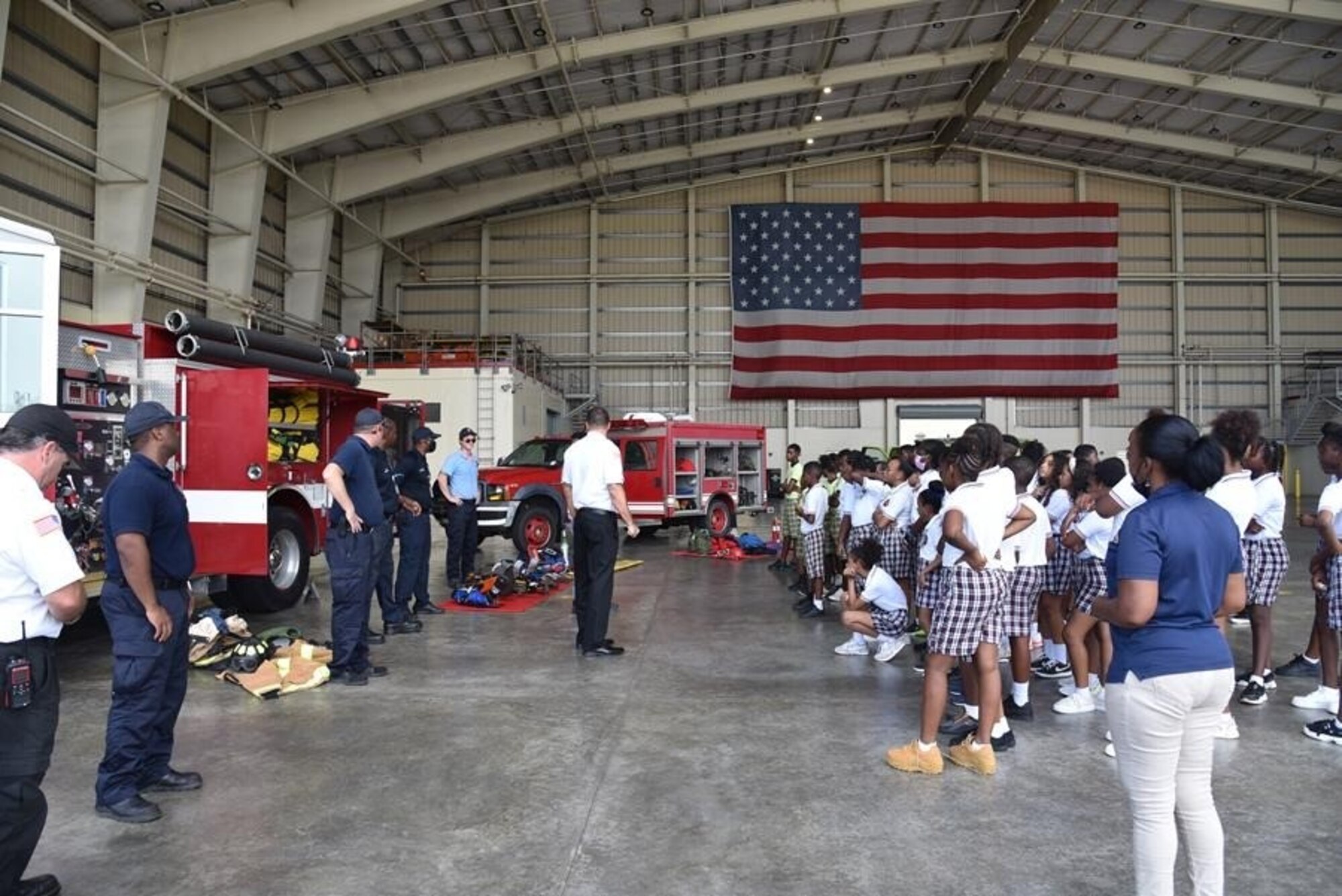 fire fighters show children fire trucks