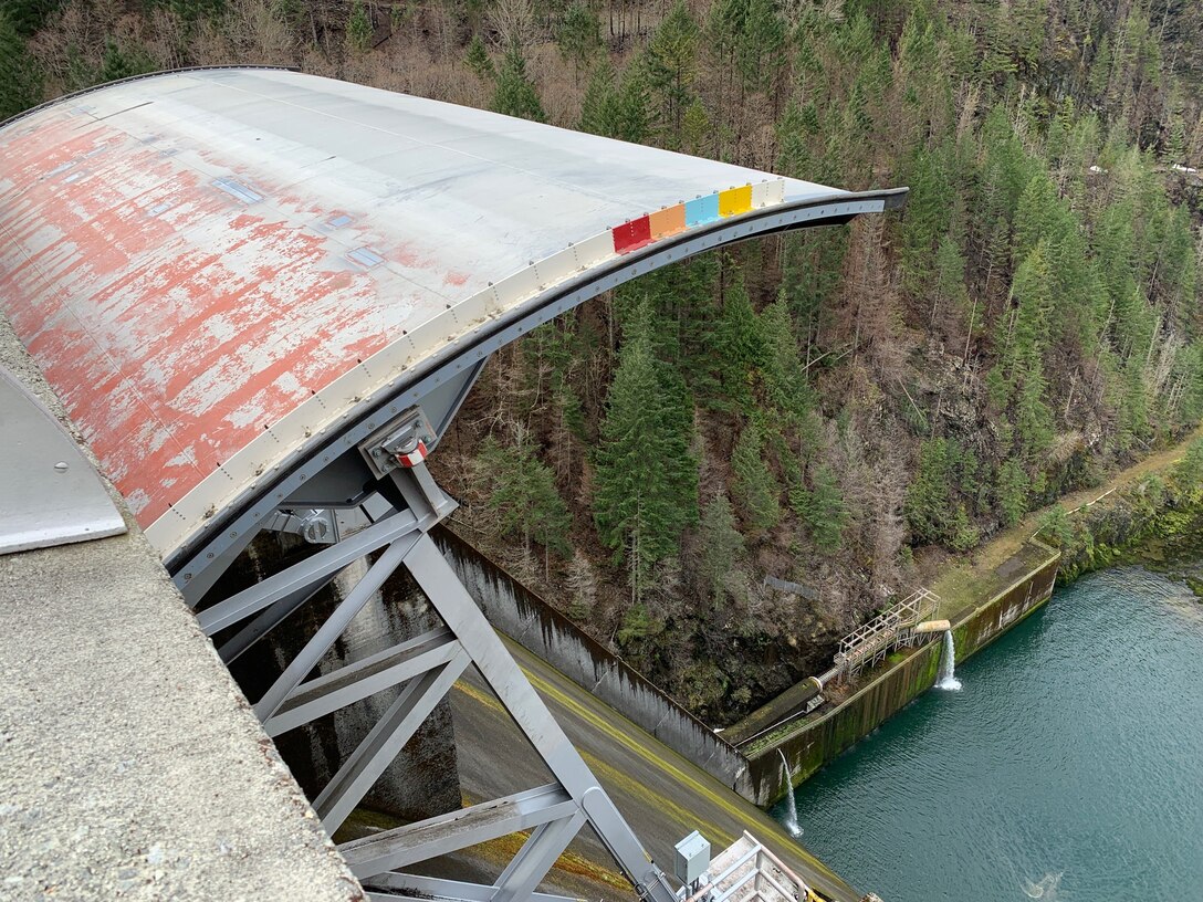 Dam operators open Detroit Dam's spillway gate. Cougar and Hills Creek dams received funding for repairs. Funds come from the Infrastructure Investment and Jobs Act (IIJA) and the Disaster Relief Supplemental Appropriations Act.