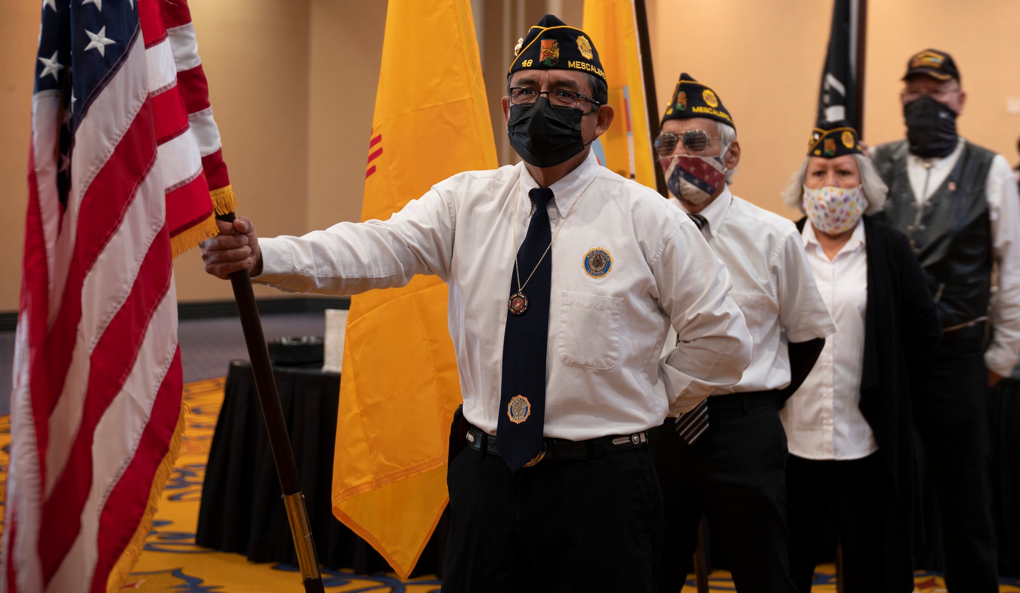 Veterans from the Mescalero Apache Tribe standby as they prepare to conduct the posting of colors before the Mescalero Apache Tribe 2022 Inauguration in Mescalero, New Mexico, Jan. 14, 2022. Before significant tribal ceremonies, the colors are posted while members from the Mescalero Apache Tribe sing an honorary flag song. (U.S. Air 
Force photo by 
Airman 1st Class Antonio Salfran)