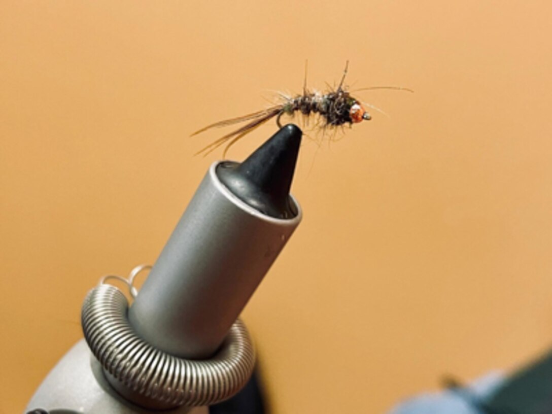 A program at the Fort Campbell Soldier Recovery Unit (SRU) in Kentucky allows recovering Soldiers to try their hand at fly fishing, including how to tie various flies and how to cast a fly rod.