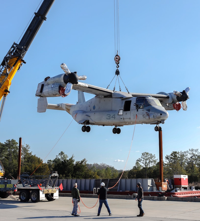 A stricken MV-22 Osprey is off-loaded at the Navy Boat Docks on Marine Corps Air Station Cherry Point, North Carolina, Jan. 14, 2022. The aircraft will be used as a maintenance and overhaul trainer for Fleet Readiness Center East employees to hone their skills before working on a fleet aircraft. (U.S. Marine Corps photo by Lance Cpl. Noah Braswell)