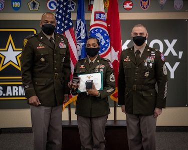 Soldiers stand together during ceremony.